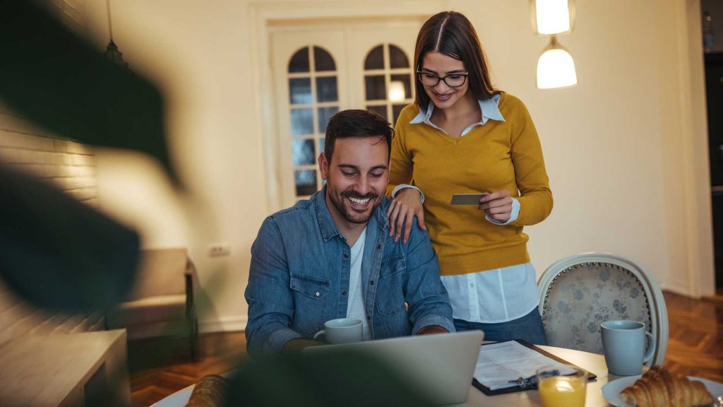 couple checking their laptop