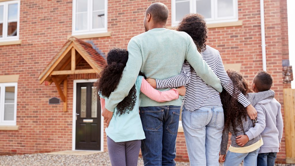 a family looking at a house